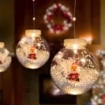 Bestseller Family LED fényfüggöny hógömb mikulással 2,7x0,75 m 110 meleg fehér LED IP44 58917